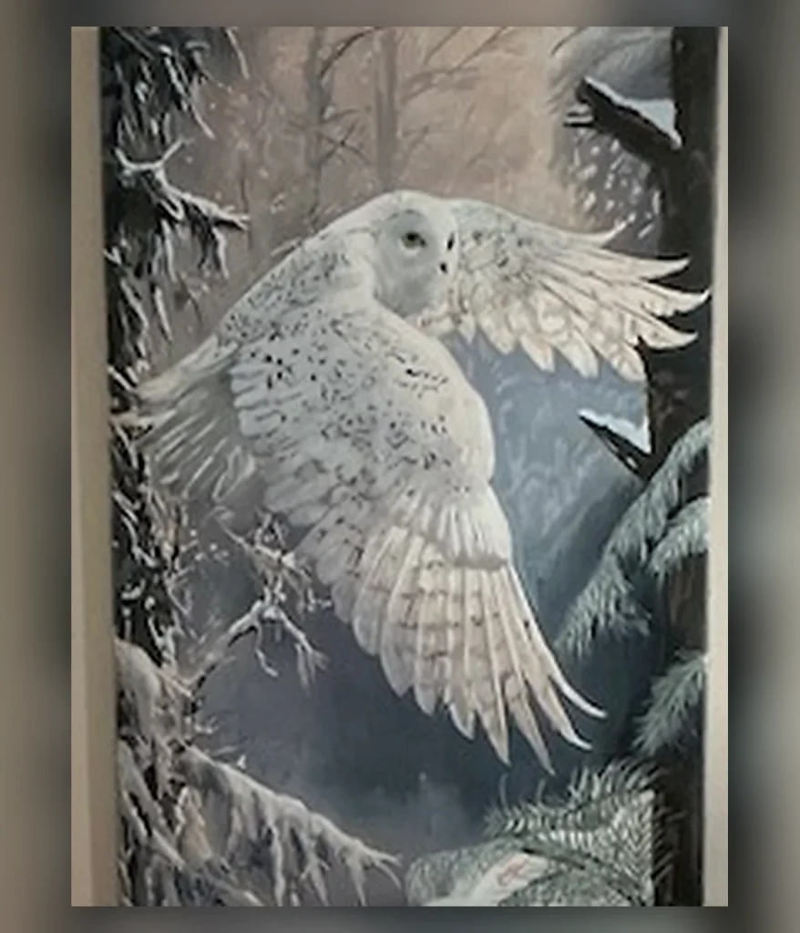Snowy owl flying through a winter forest