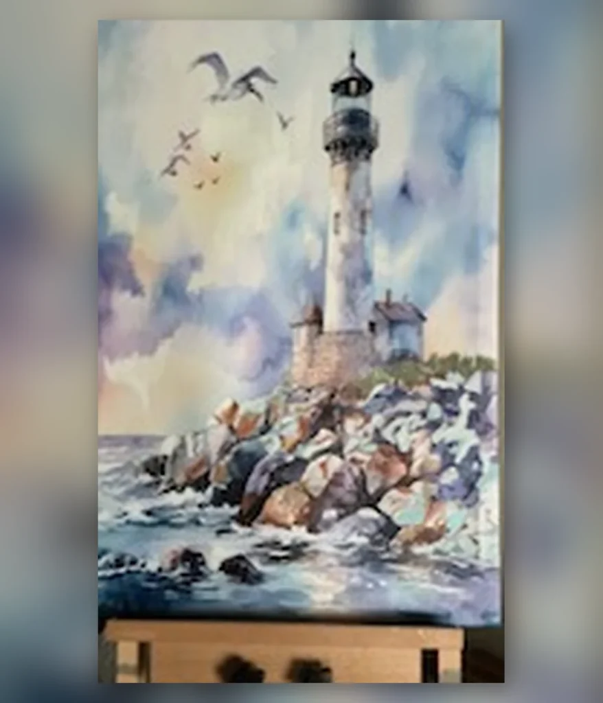 Lighthouse standing above a rocky coastline